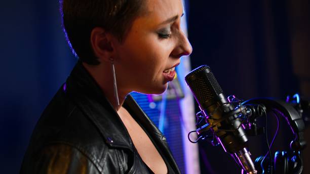 istock Live vocalist delivering a powerful thrash metal performance 2184843814