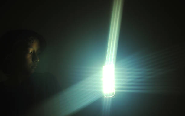 istock Girl bringing a flashlight in the dark. 2184844724