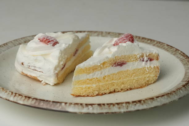 istock Two Japanese strawberry shortcakes on a stylish large plate on a white table 2184846705