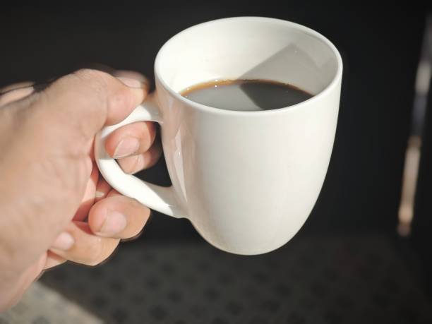 istock White coffee cup on Antique Area Rugs background 2184850373