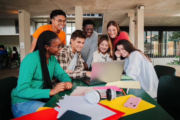 istock Big group of multiracial teenage students using laptop, working on university assignment homework project on high school library. Teamwork of diverse young colleagues searching information on computer 2184850713
