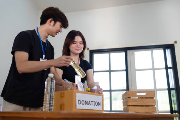 istock Volunteers Organizing Food Donations for Community Support Initiative 2184850959
