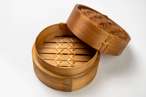 istock Chinese dim sum dumpling bamboo bowl basket isolated over white background 2184853036