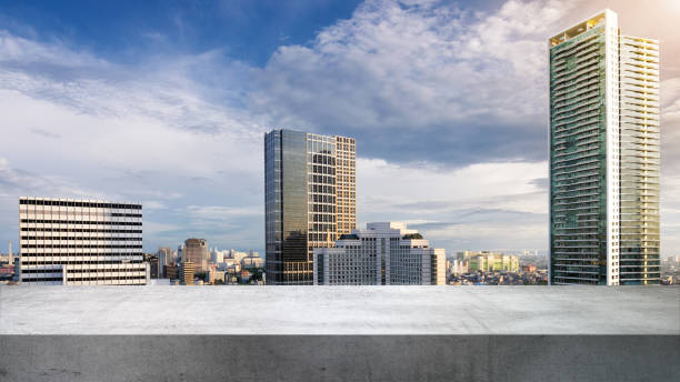 istock Empty rooftop with view of modern building skyscrapers and futuristic architecture with blue sky background 2184854103