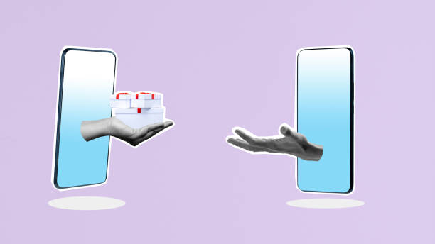 istock Human hand from mobile phone screen give gift boxes to other with colored background 2184856558