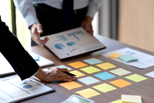 istock they have collected and transcribing it onto sticky color notes 2184861687