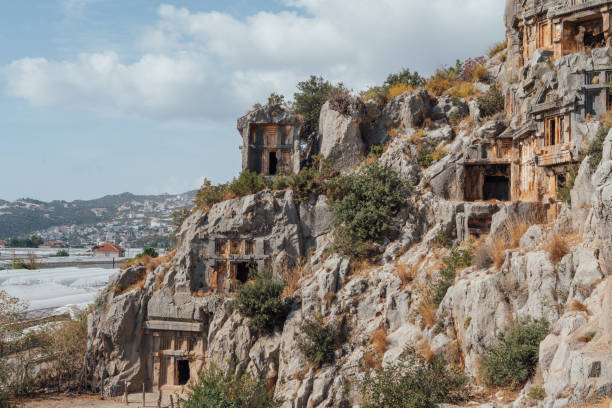 istock Ancient Lycian rock-cut tombs in Myra, Turkey carved directly into towering cliffs showcase intricate architecture. Historic necropolis reveals craftsmanship of ancient civilizations 2184863055
