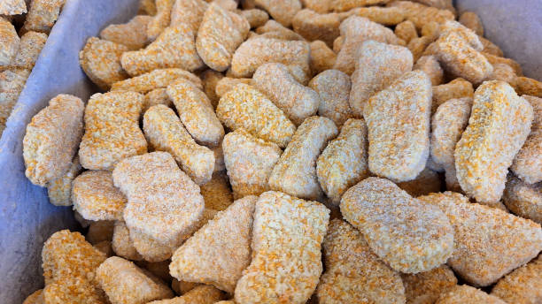 istock Raw and Frozen chicken nuggets. 2184865410