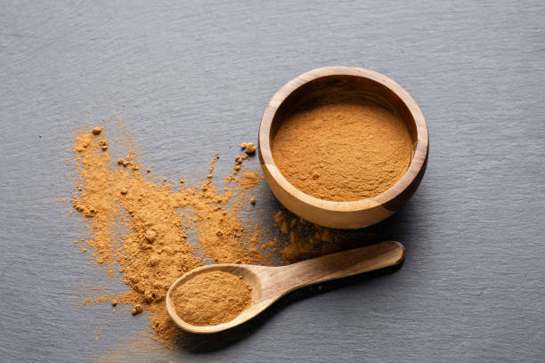 istock Cinnamon Sticks and Powder on Gray Slate 2184868889