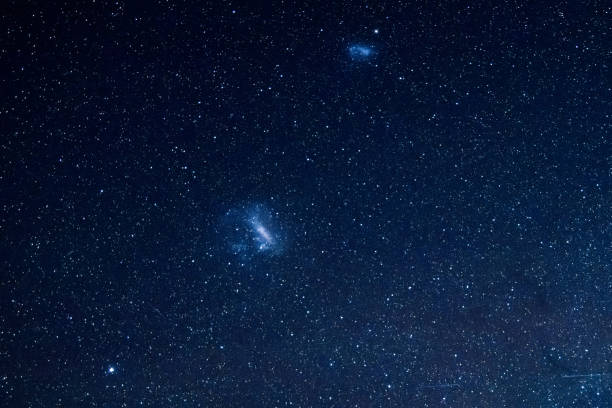 istock Stargazing at the celestial night sky and magellanic clouds 2184875331