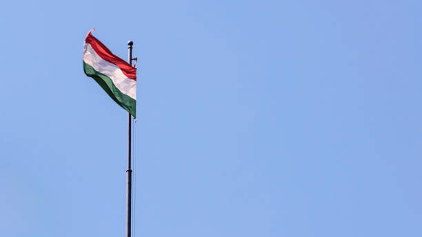 istock Hungarian flag gently fluttering against bright blue sky 2184878591