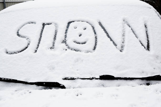 istock snow on car glass 2184879420