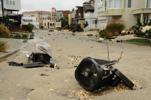October 26, 2012, Longport, New Jersey, USA, A beach community is damaged by a hurricane with sand filled street and damages shown in the foreground.