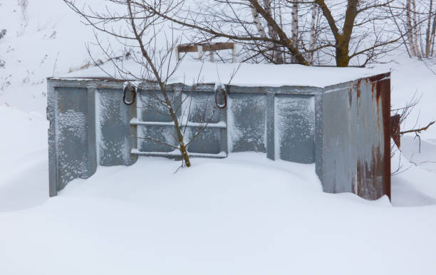 istock A metal structure covered in snow sits in a snowy field 2184884060