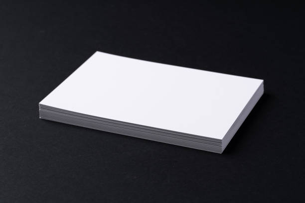 istock White blank business cards on dark black background 2184887254