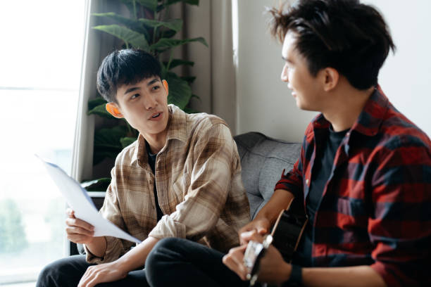 istock Two Asian Chinese men playing Ukulele in the house. 2184888976