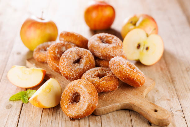 istock apple donut on wooden background 2184889053