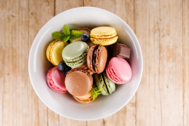 istock colorful macaroons in bowl, top view 2184889055