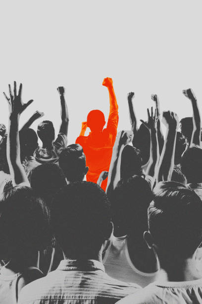 istock Contemporary art collage. Crowd's attention gravitates towards central bright orange figure. Spirit of loyalty and shared victory in sports. 2184892532