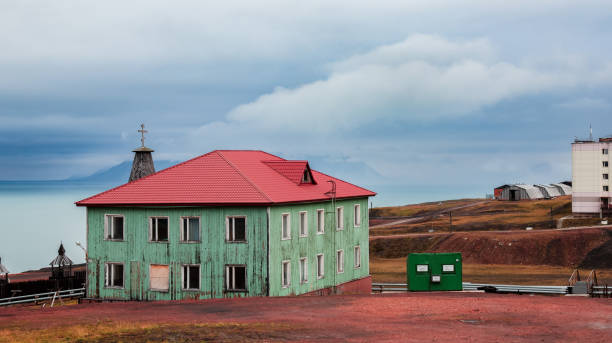 istock Old buildings with colorful roofs in Barentsburg, Svalbard, under a cloudy sky 2184893605