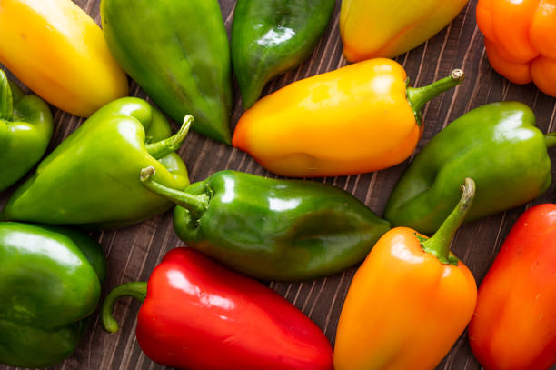 istock Pepper. vegetables on a wooden background, top view, flatley. 2184893731