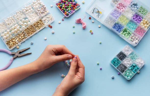 istock Creating colorful beaded jewelry with vibrant materials on a crafting table 2184898448