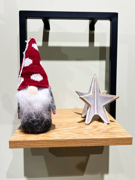 istock Decorative wooden shelf with festive gnome and ceramic star decor 2184899195