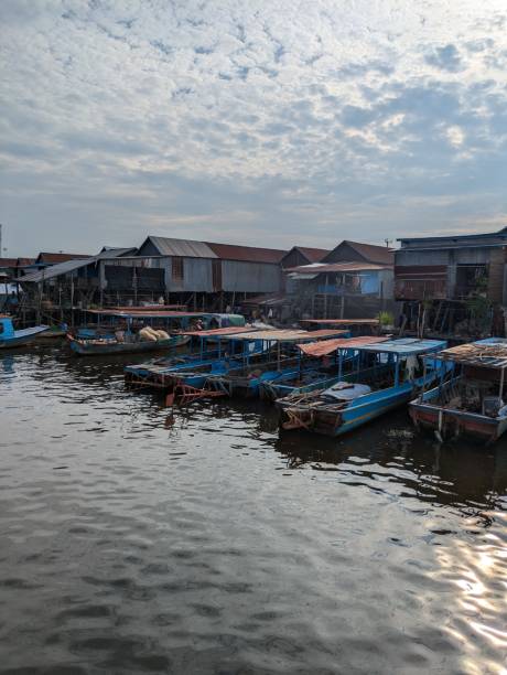 istock Floating Village and boats with sunlight reflection on the water 2184901308