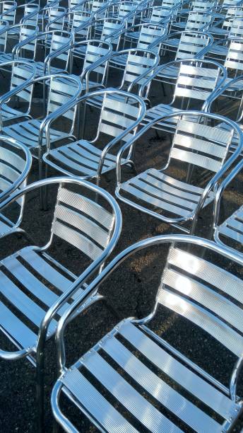 istock aluminum chairs lined up on the ground 2184910742