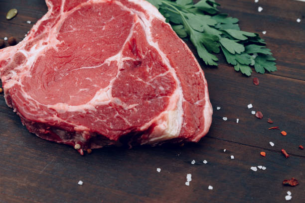 istock Raw beef meat fillet on wooden board 2184911788