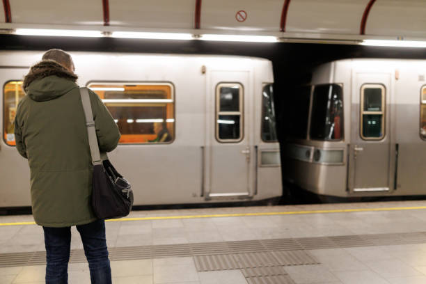 istock Mature man waiting for the train in subway station 2184912147