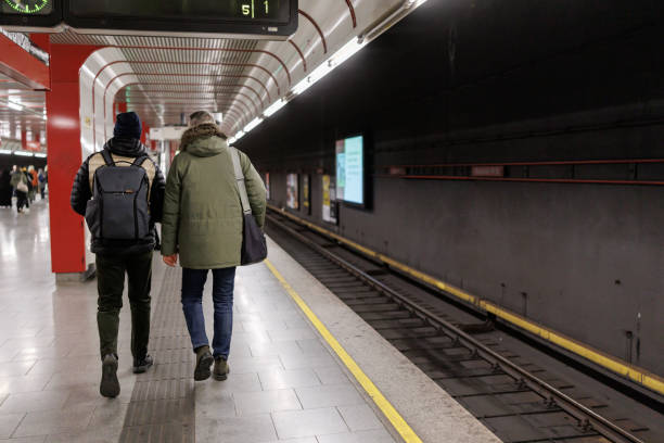 istock Male tourists on subway station 2184912758