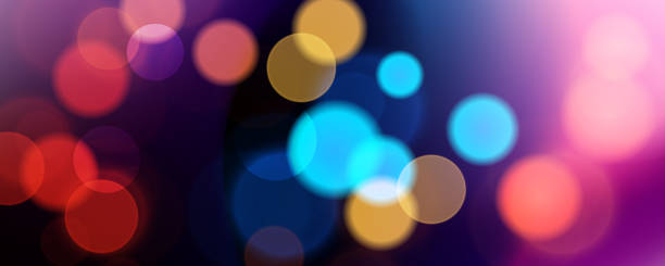istock Abstract festive blurred background. Vibrant bokeh lights. Bright defocused glowing lights effect. City night. 2184912878