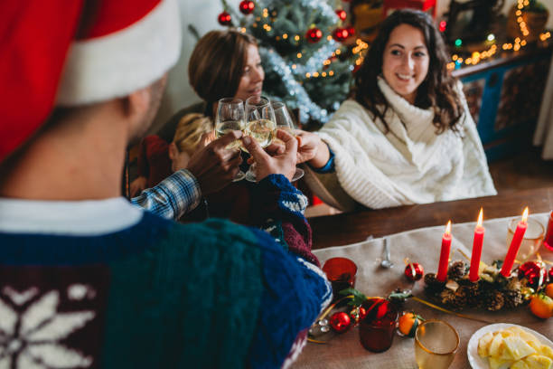 istock Family toasting with white wine during christmas dinner 2184915597