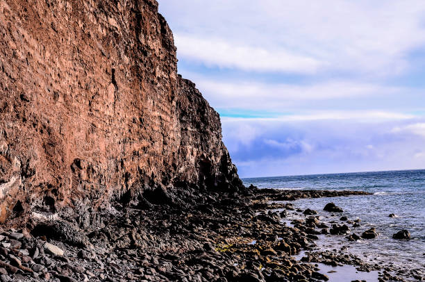 istock A rocky cliff overlooks the ocean 2184916177