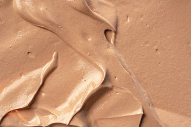 Background of a smudged cream foundation texture