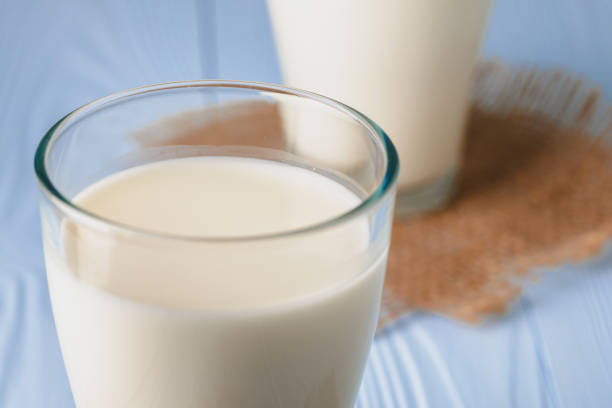 Glass of milk on table close up, copy space