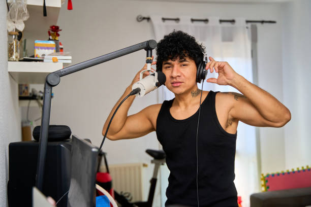 istock latin man singing and recording the song with a microphone 2184918954