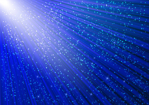 istock Sparkling glitter and glowing rays with shiny stars. Christmas blue background. 2184920883
