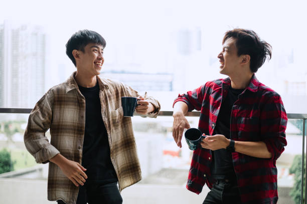 istock Two Asians Chinese talking at balcony. 2184921054