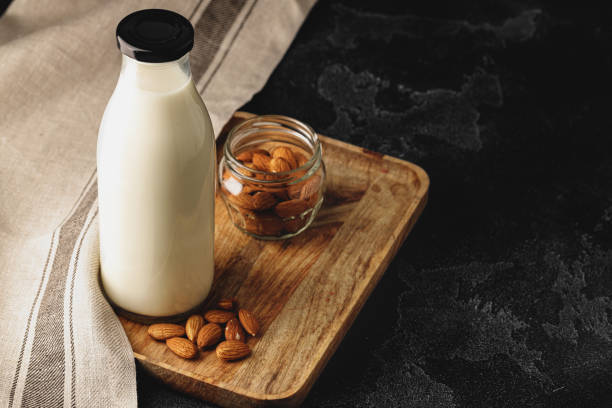 istock Almond milk with almond nuts in glass 2184922493