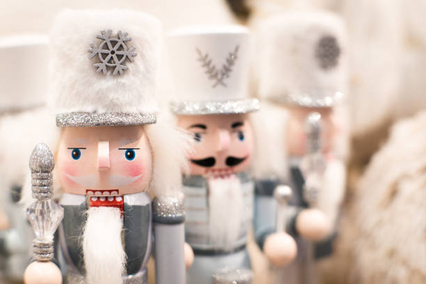 Close-up of brightly colored wooden nutcrackers for sale at grocery store during Christmas season.