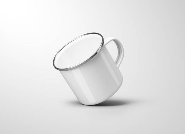 istock White enamel mug mockup, metal cup with mirrored rim, handle, isolated on background. 2184924902
