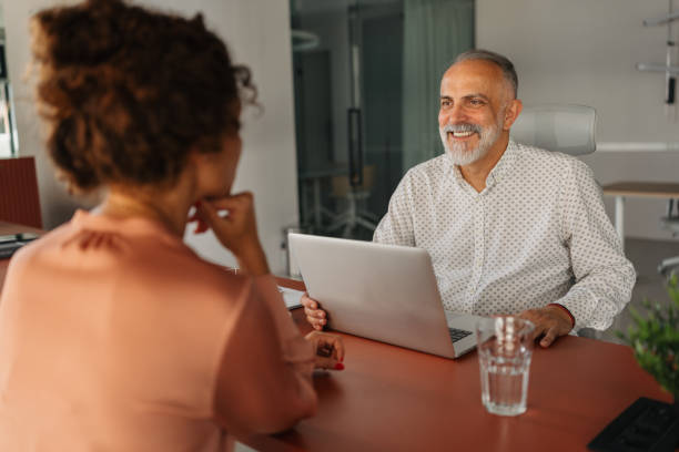 istock Engaged meeting between a woman and mature professional 2184925330