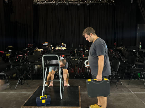 Technicians preparing the theater stage for a concert