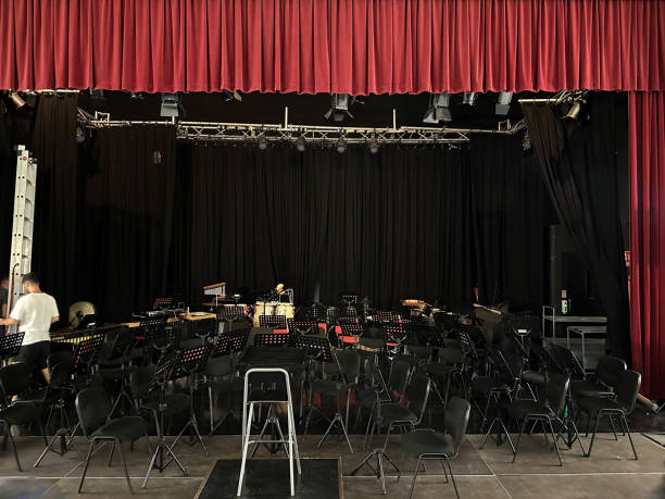 Technicians preparing the theater stage for a concert