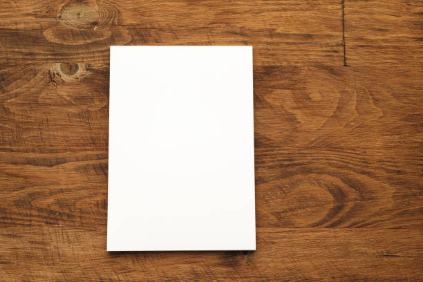 istock Blank businesscard stacks on rough wooden table 2184929707