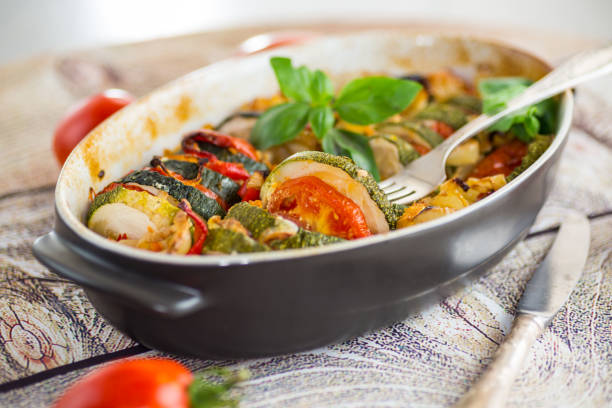 istock prepared baked zucchini and tomatoes in circles in a ceramic form, vegetable snack 2184929948