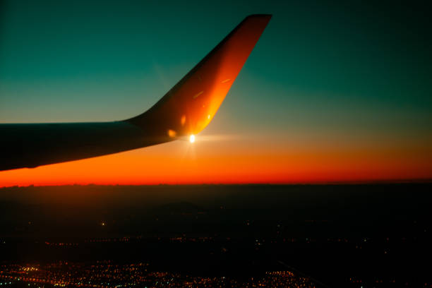 View from airplane window at sunrise or sunset