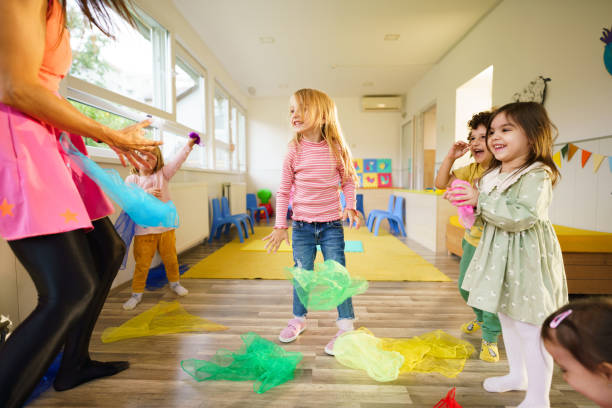 istock Children dance with the animator 2184931694